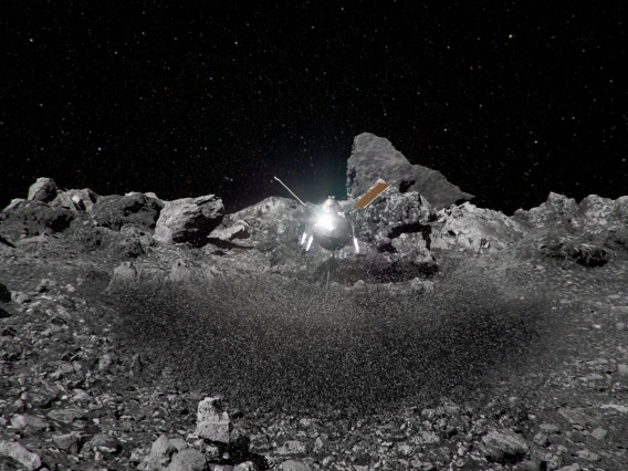 Artist&#039;s impression of the OSIRIS-REx spacecraft kicking up rocks during sample collection on asteroid Bennu&#039;s surface